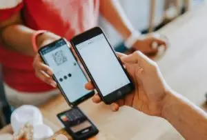 bancnet user paying via qr ph code at a store, with over 200,000 stores now accepting qr code payments